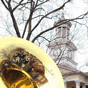 parade reflected in tuba bell