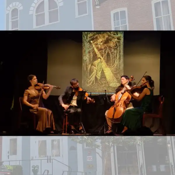 musicians playing in front of screen (art)