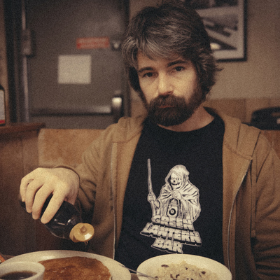 John R Miller at table