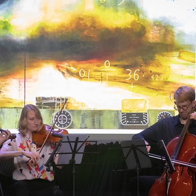 ACMF - 2 performers in front of screen